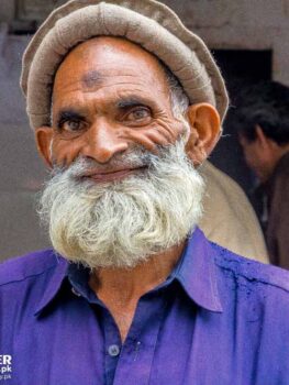 Happy Poor Old Man Standing By The Roadside In Murree